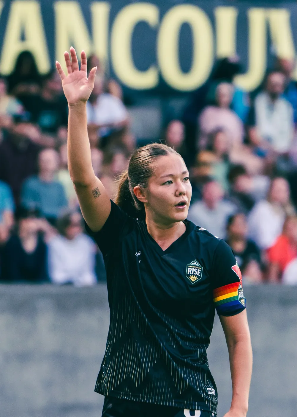 Vancouver Rise FC player waving to crowd